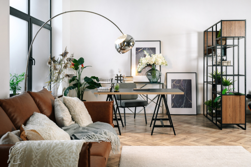 sitting area with desk and open shelves